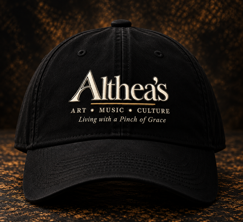 Black Althea's signature cap with logo, front view, on textured dark studio background
