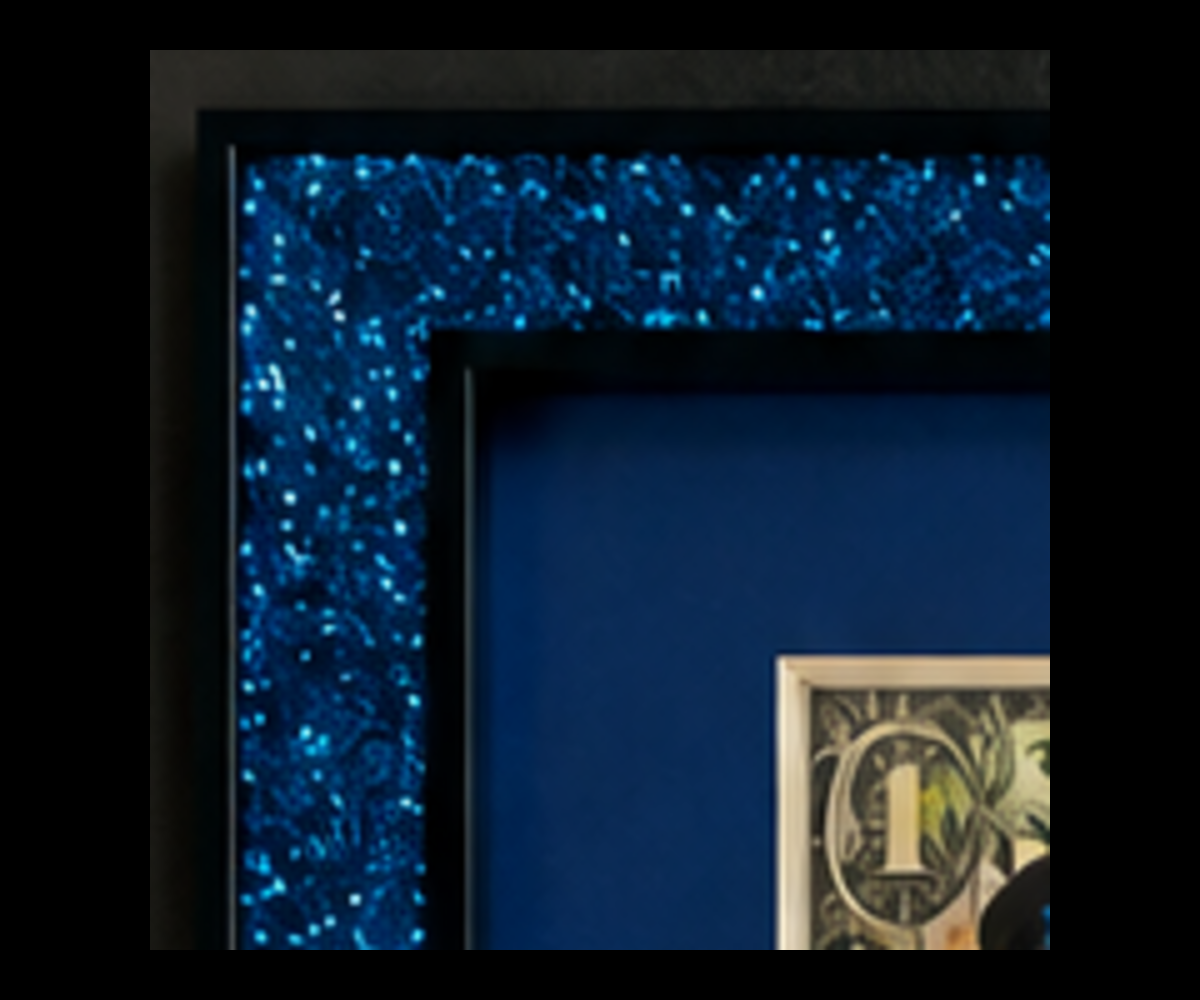 Blue glitter and black custom-frame detail for David Bowie on Dollars