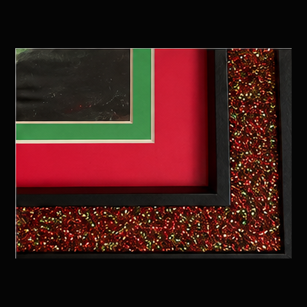 The Grinch frame corner showing red and green mats and glitter detail