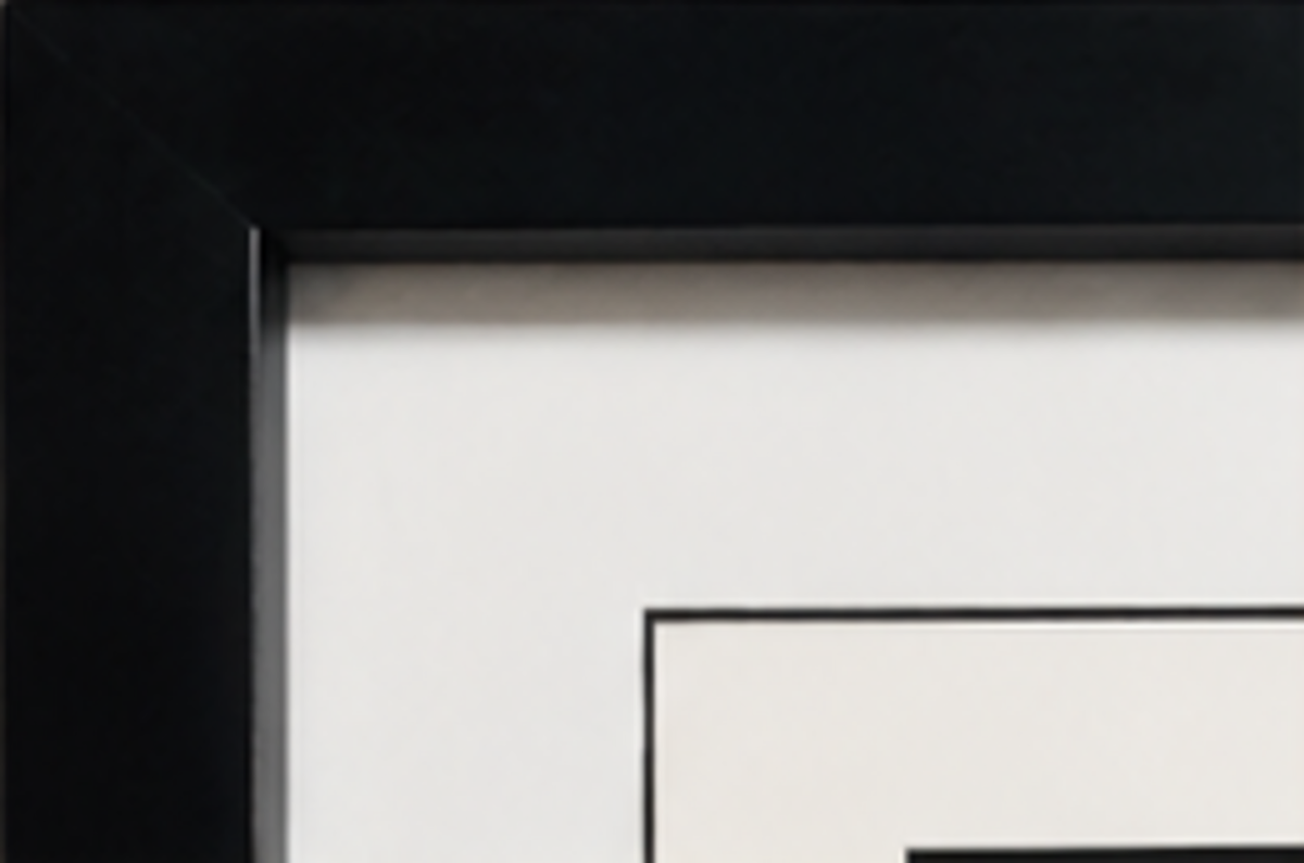 Black gallery frame and white mat detail
