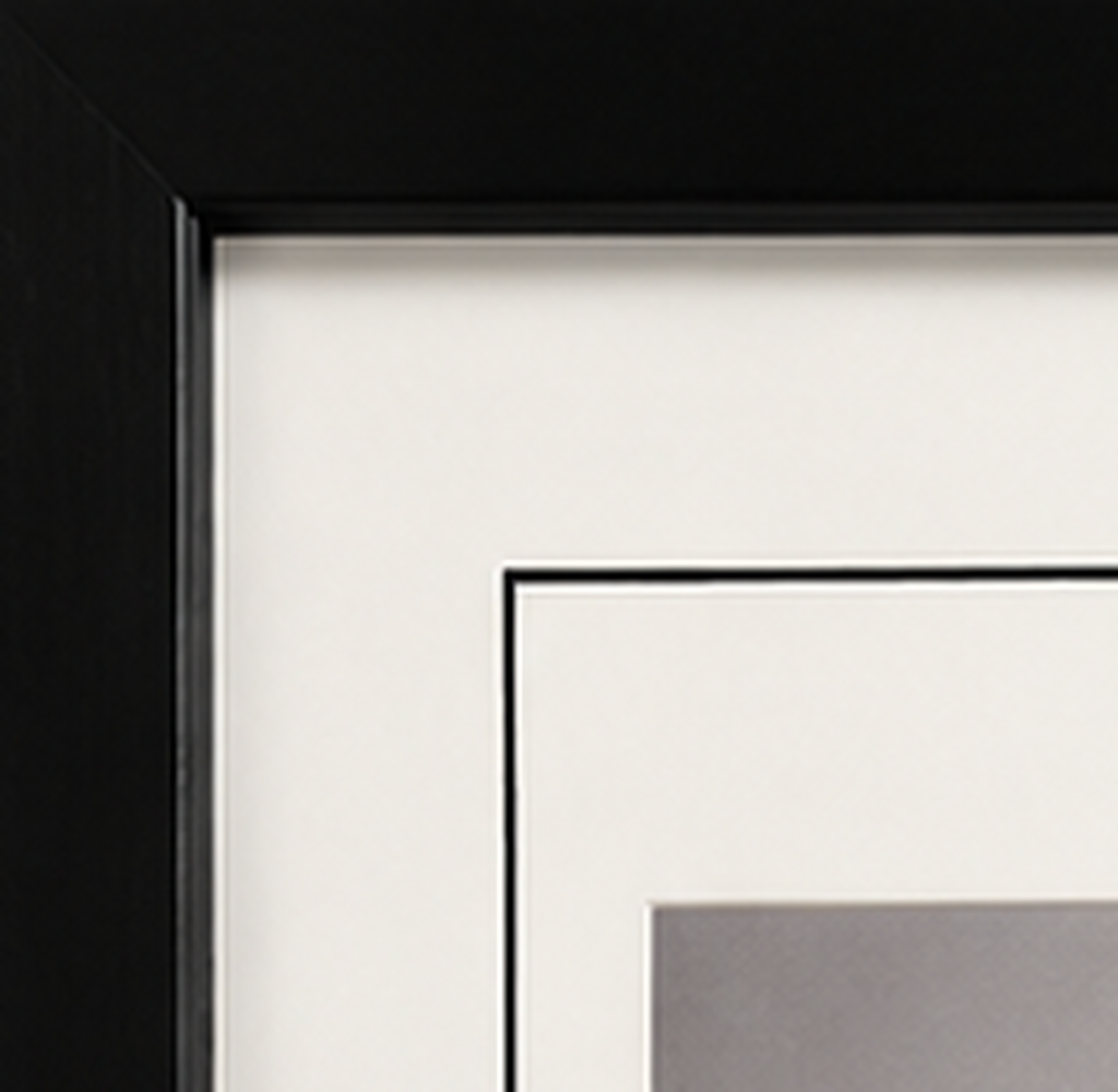 Close-up of the black wood gallery frame, white mat, and black core