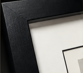Black wooden gallery frame and white mat detail