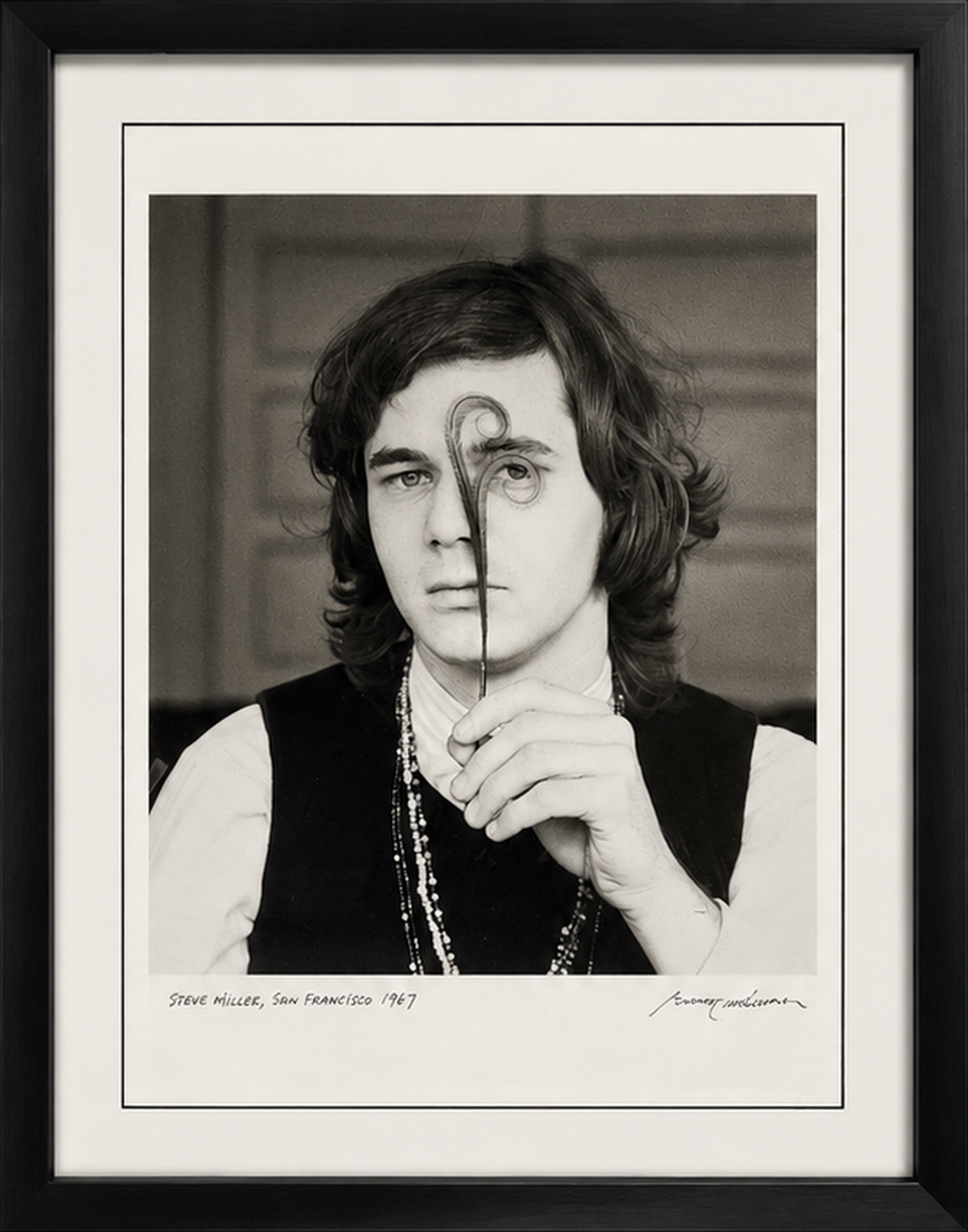 Full framed Steve Miller in San Francisco, 1967 photograph by Baron Wolman, cropped to the black frame